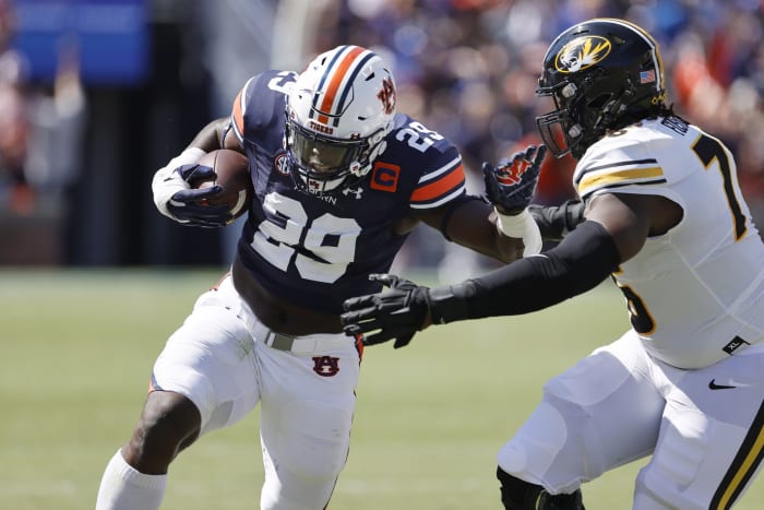 Sep 24, 2022; Auburn, Alabama, USA; Auburn Tigers linebacker Derick Hall (29) returns an interception as Missouri Tigers offensive lineman Javon Foster (76) goes for the tackle during the first quarter at Jordan-Hare Stadium. Mandatory Credit: John Reed-USA TODAY Sports